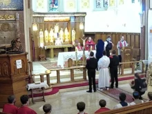 Police halt a Good Friday liturgy at Christ the King Church in Balham, London, England, April 2, 2021